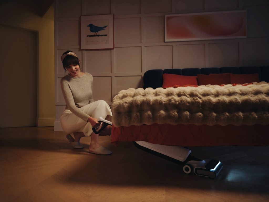 Roborock Flexi Pro reaching under bed with LED light
