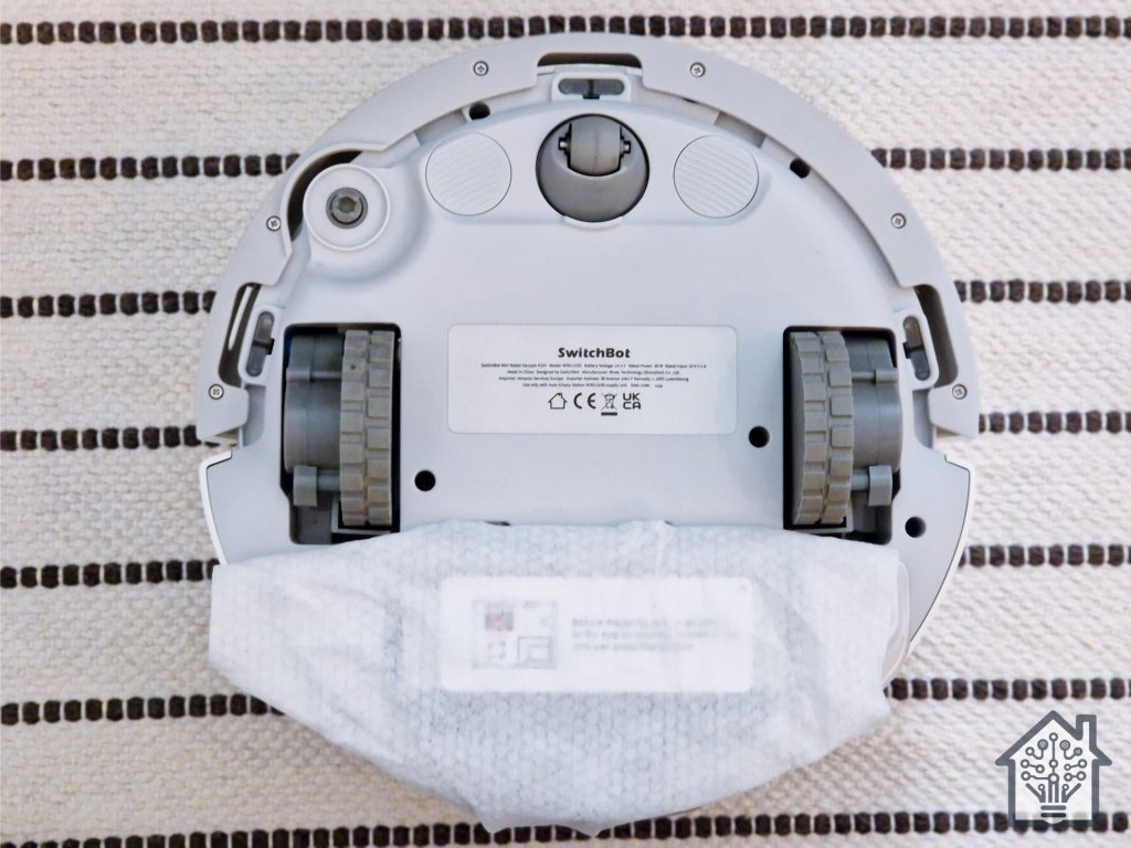 SwitchBot K10+ robot vacuum showing its mopping module with a wipe installed